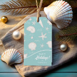 Shells Starfish Sun Fun Text Ivory ID918  Gift Tags<br><div class="desc">Infuse your gift giving with coastal charm using this stunning gift tag, featuring a playful pattern of seashells, starfish, and fun beach-inspired text. The ivory white pattern, on your choice of background colours (shown here on teal blue), evoke a relaxed summer, beach house vibe. This design is sure to add...</div>