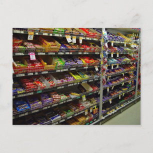 Shelves of chocolate bars in store postcard