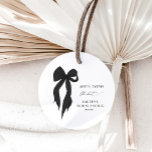She's Tying The Knot Black Bow Bridal Shower Classic Round Sticker<br><div class="desc">Add a touch of elegance to your event with our She’s Tying The Knot Black Bow Bridal Shower Classic Round Sticker. Featuring a chic black bow design, these stickers are perfect for sealing invitations, decorating favour bags, or adding a stylish flair to your bridal shower decor. The timeless black bow...</div>