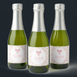 She's Tying the Knot Coquette Bow Bridal Shower Sparkling Wine Label<br><div class="desc">This charming bridal shower invitation in soft pink with a delightful bow design sets the perfect tone for a Soft Pink Coquette Bridal Shower. The delicate colour scheme and elegant design make it a sweet choice for celebrating the bride-to-be!</div>