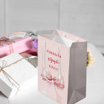 She's tying the knot pink bow Bridal Shower Medium Gift Bag<br><div class="desc">A blush pink background decorated with a pink coloured bow. Personalise and add a name
Text: She's tying the knot.</div>