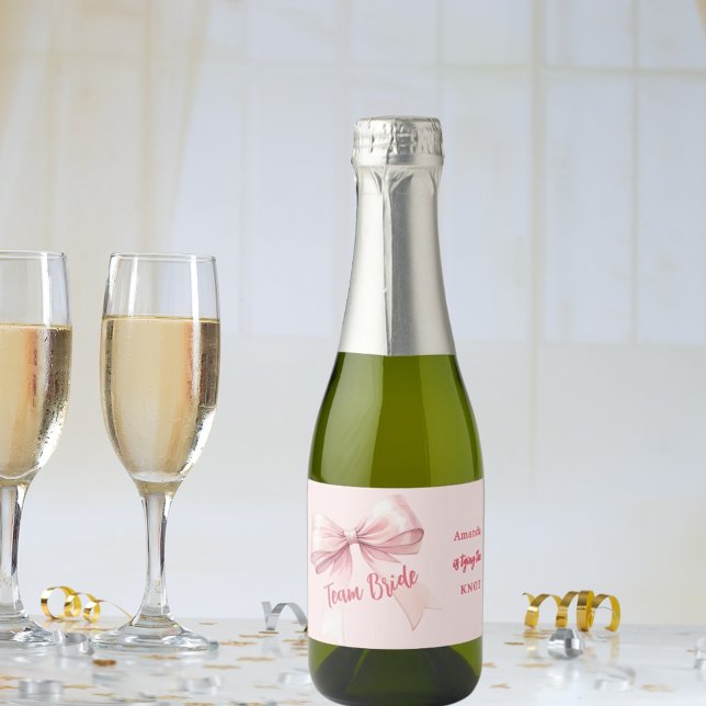 She's tying the knot pink bow Team Bride Sparkling Wine Label (Creator Uploaded)