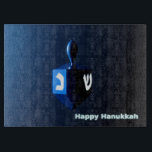 Shiny Blue Dreidel Cutting Board<br><div class="desc">A modernistic,  metallic blue dreidel against a dark,  night-like background.  Two of the Hebrew letters found on a dreidel,  nun and shin,  glow brightly.  Text reading "Happy Hanukkah" also appears in glowing blue and white.</div>