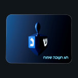 Shiny Blue Dreidel Magnet<br><div class="desc">A modernistic,  metallic blue dreidel against a dark,  night-like background.  Two of the Hebrew letters found on a dreidel,  nun and shin,  glow brightly.  Hebrew text reading "Chag Chanukkah Sameach" (Happy Hanukkah) also appears in glowing blue and white.</div>