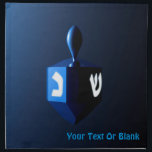 Shiny Blue Dreidel Napkin<br><div class="desc">A modernistic,  metallic blue dreidel against a dark,  night-like background.  Two of the Hebrew letters found on a dreidel,  nun and shin,  glow brightly.  Add your own text.</div>