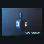 Shiny Blue Dreidel Placemat<br><div class="desc">A modernistic, metallic blue dreidel against a dark, night-like background. Two of the Hebrew letters found on a dreidel, nun and shin, glow brightly. Hebrew text reading "Chag Chanukkah Sameach" (Happy Hanukkah) also appears in glowing blue and white.</div>