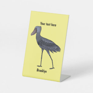 Shoebill bird cartoon illustration pedestal sign