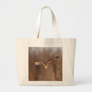 Short-eared owl diving towards the ground large tote bag