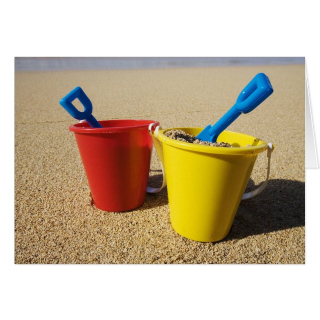 Shovels And Pails On Sandy Beach (Front Horizontal)