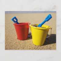 Shovels And Pails On Sandy Beach