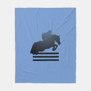 Show jumper clearing an obstacle. Fleece Blanket