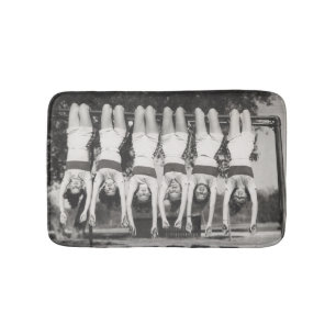 Showgirls on monkey bars, playful design. bath mat