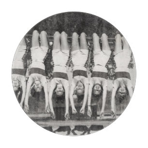 Showgirls on monkey bars, playful design. cutting board