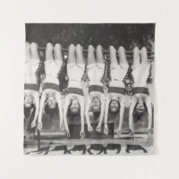 Showgirls on monkey bars, playful design.