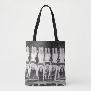 Showgirls on monkey bars, playful design. tote bag