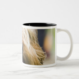 showing tongue, long hair, portrait Two-Tone coffee mug