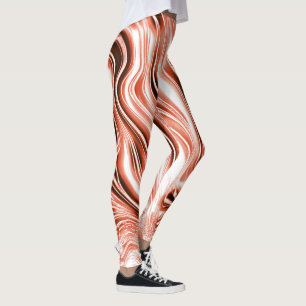 Showy green and red long wavy traces on black fund leggings