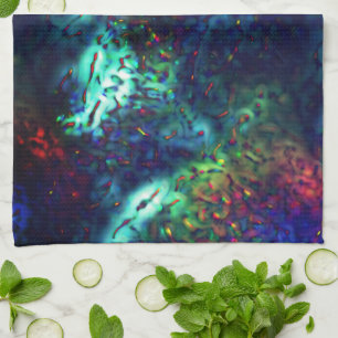 Showy scales on a dark blue to coloured background tea towel