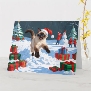 Siamese Cat Running in Snow with Christmas Hat Card
