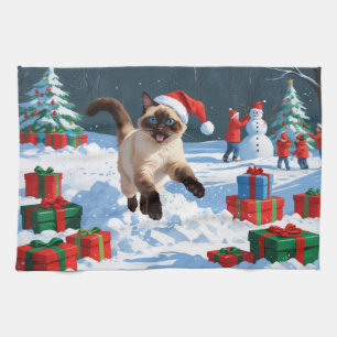 Siamese Cat Running in Snow with Christmas Hat Tea Towel