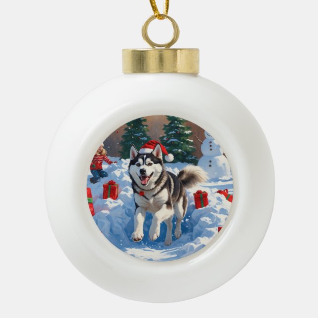 Siberian Husky Running in Snow with Christmas Hat Ceramic Ball Christmas Ornament (Front)