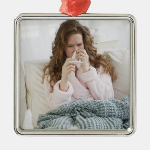 Sick woman on couch metal tree decoration