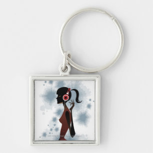 Side view of woman listening music key ring