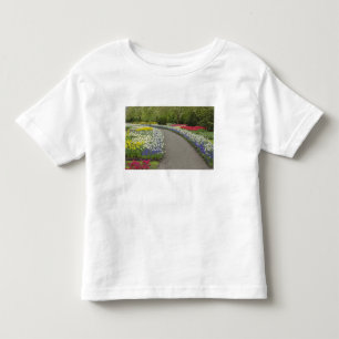 Sidewalk pathway through tulips and daffodils, 2 toddler T-Shirt