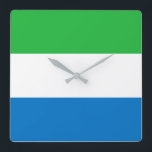 Sierra Leone Flag Square Wall Clock<br><div class="desc">The Sierra Leonean is a horizontal tricolour. The used colors in the flag are blue,  green,  white. The proportion of the Sierra Leonean is 2:3. The Flag of Sierra Leone was adopted in 1961.</div>