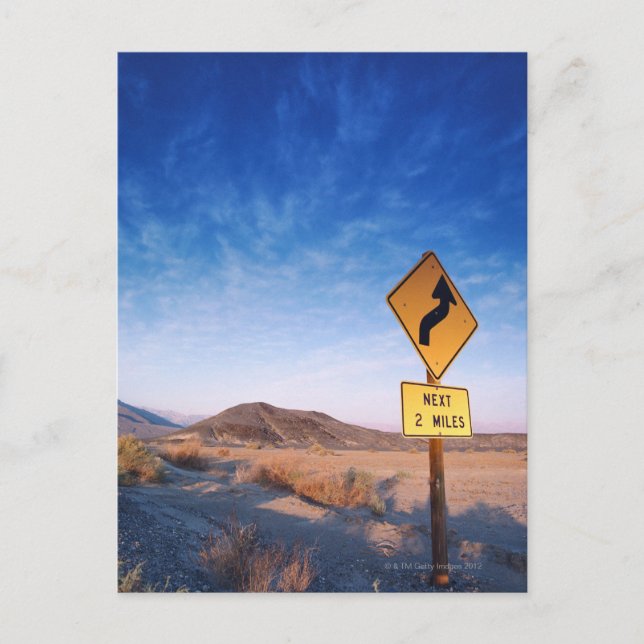Sign on the death valley road in sunset postcard (Front)
