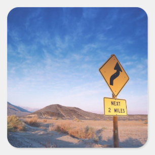 Sign on the death valley road in sunset square sticker