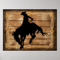 Silhouette cowboy on a bucking bronco horse