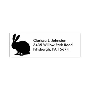 Silhouette in black of a fuzzy sitting bunny  self-inking stamp