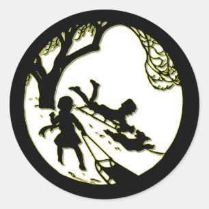 Silhouette of children sledding with their dog classic round sticker