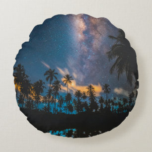 Silhouette of coconut trees reflected on body of w round cushion