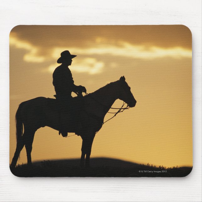 Silhouette of cowboy on horseback at sunset or mouse mat (Front)