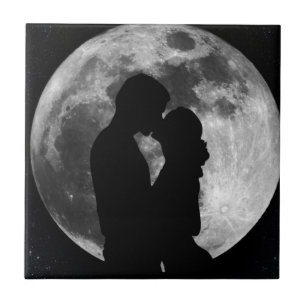 Silhouette of lovers in a full moon at night tile