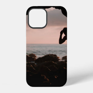 Silhouette of man in cave iPhone 12 case