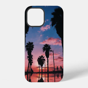 Silhouette of tree under cloudy sky iPhone 12 case