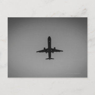 Silhouetted aircraft landing postcard