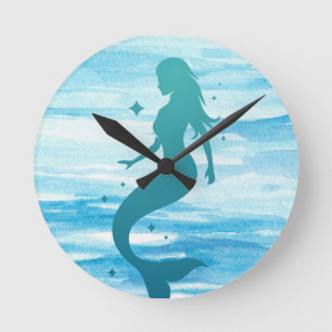 Silhouetted mermaid on a wall clock