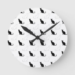 Silhouettes Of Black and White Cats Round Clock