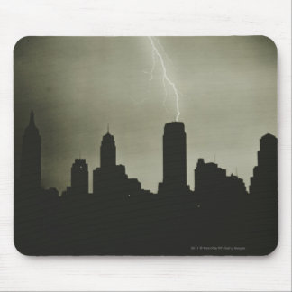 Silhouettes of skyscrapers and lightning in sky mouse mat