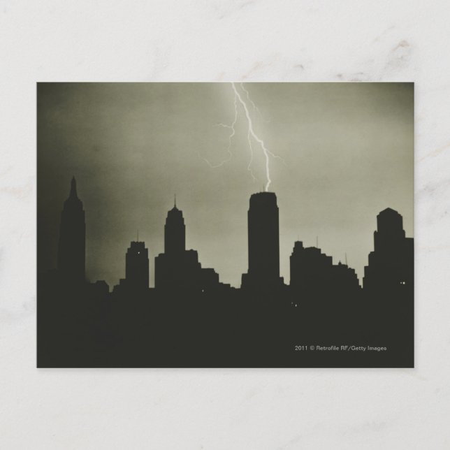 Silhouettes of skyscrapers and lightning in sky postcard (Front)