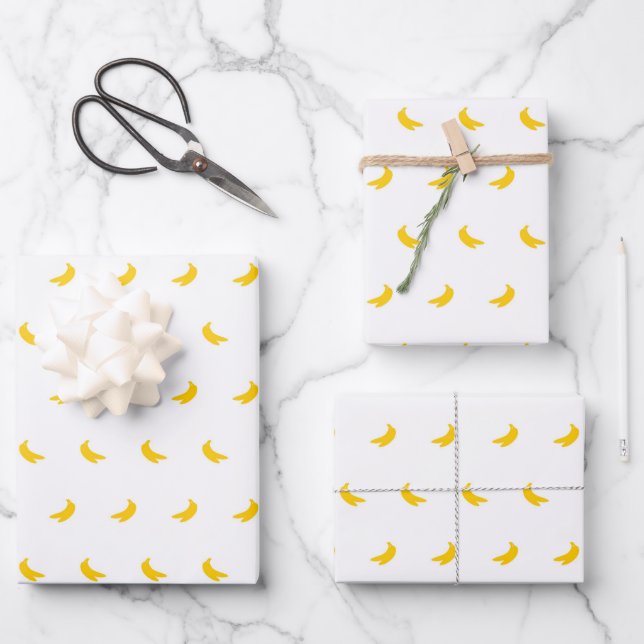Silhouettes of Small Yellow Bananas on White Wrapping Paper Sheet (Front)