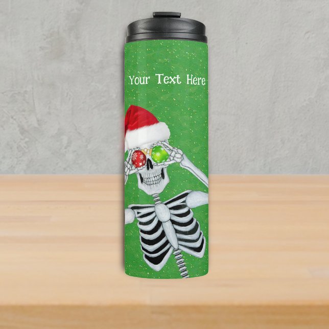 Silly Christmas Skeleton Ornament Eyes Green Gold Thermal Tumbler (Funny Christmas skeleton Santa Hat Ornament eyes on green with gold specks thermal drink tumbler.)