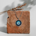 Silver Evil Eye Necklace - Symbol of Protection<br><div class="desc">Our evil eye necklace is perfect for those seeking a unique blend of fashion and spirituality. Made with love and attention to detail, this jewellery piece is suitable for everyday wear or special occasions. Embrace the ancient symbolism of the evil eye and its protective qualities with this stunning silver necklace....</div>