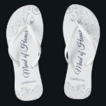 Silver Lace Navy on White Maid of Honour Wedding Flip Flops<br><div class="desc">These beautiful wedding flip flops are a great way to thank and recognise your Maid of Honour while saving her feet at the same time. Features an elegant design with silver grey lace on a white background and fancy navy blue coloured script lettering. The test reads Maid of Honour with...</div>