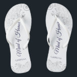 Silver Lace Navy on White Maid of Honour Wedding Flip Flops<br><div class="desc">These beautiful wedding flip flops are a great way to thank and recognise your Maid of Honour while saving her feet at the same time. Features an elegant design with silver grey lace on a white background and fancy navy blue coloured script lettering. The test reads Maid of Honour with...</div>