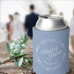 Silver Lace on Dusty Blue Maid of Honour Wedding Can Cooler<br><div class="desc">These fun wedding can coolers feature an elegant dusty blue coloured design with elegant script text reading Maid of Honour and her name surrounded by lacy faux foil silver filigree or curls and swirls. Perfect way to thank her for being part of your bridal party.</div>